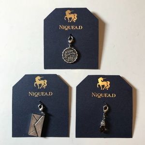 NIQUEA.D charms.